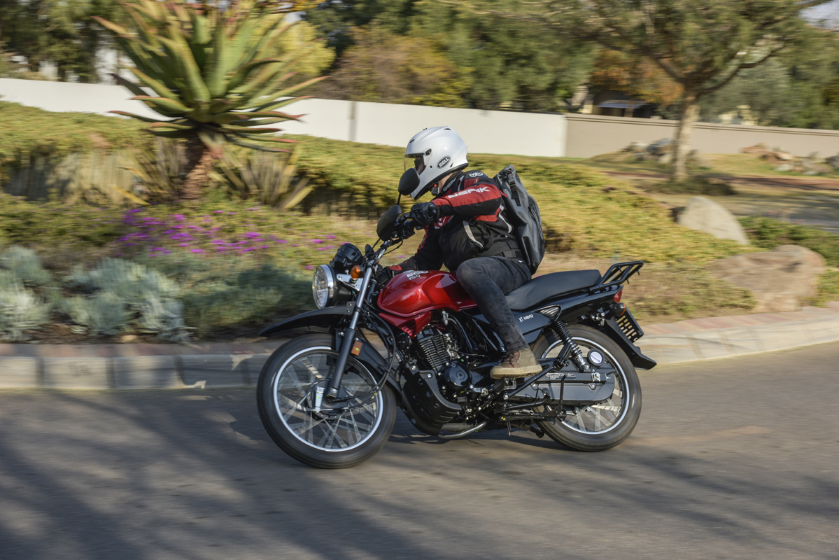 Rider travelling on a Hero Eco 150 motorcycle to represent dependable daily use and support